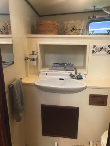 Forward two piece washroom just outside V berth door.